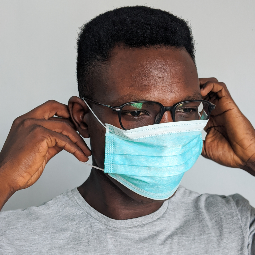 A man with a mask, indicating COVID protection.