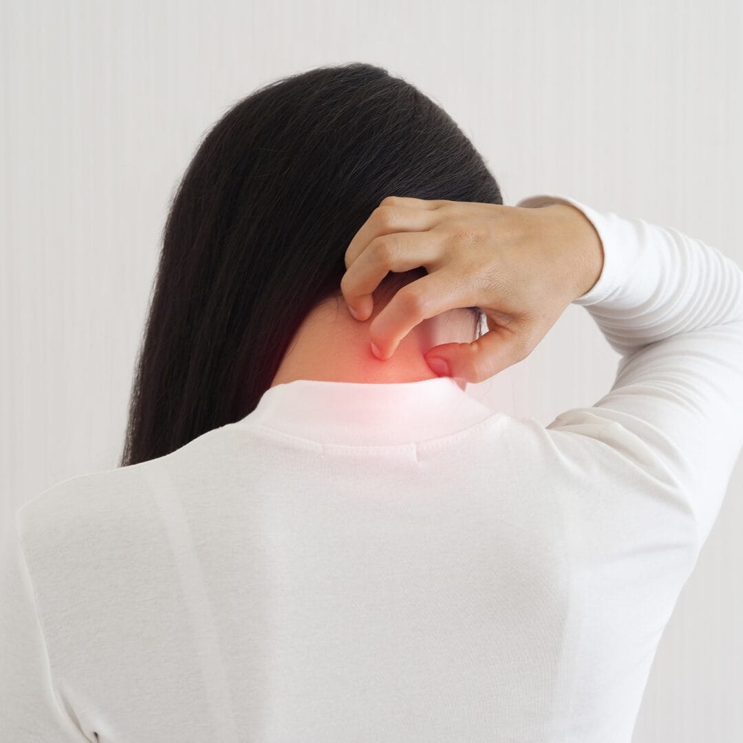 Hand touching neck as if in pain on isolated white background